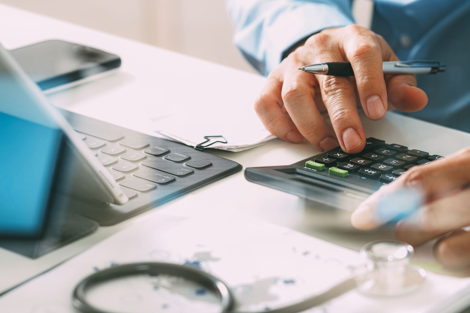 Man using calculator